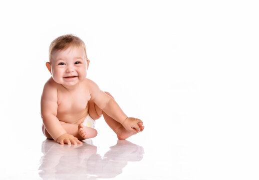 Happy smiling baby on floor over white background
