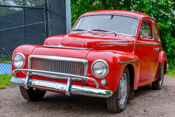 Obraz na płótnie Canvas 1961 classic car - Front view of a Swedish 1961 classic car sedan at a local car show. This model was quite popular in North America during the 1960s.