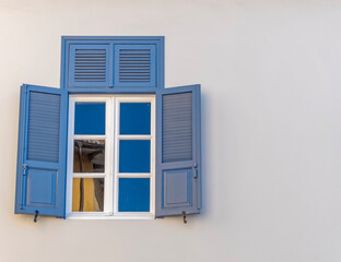 vintage blue shutters with white frame window, Athens Greece, space for text