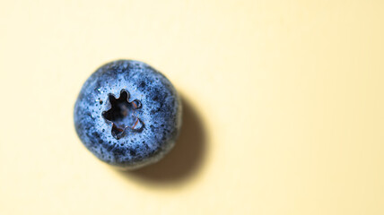 fresh juicy blueberry  on a yellow  background. Macro and close up