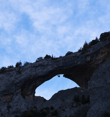 Climber in the window or dolphin of the Masc?n river, Guara Natural Park, Huesca