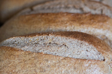 Tight shot of homemade rye breads soon after coming out of the oven.