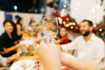 Christmas in Brazil. Family toasting at Christmas dinner.