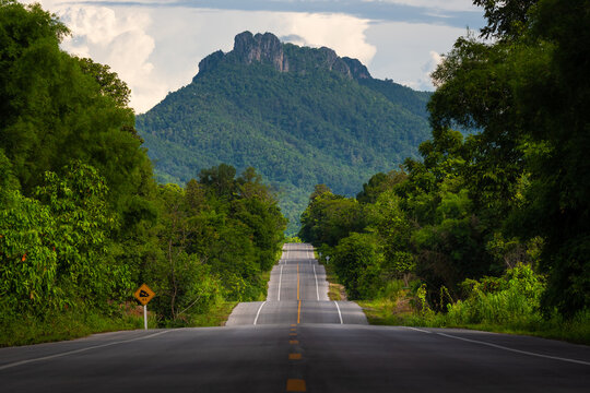 Bumpy asphalt road on hill in Lampang Thailand