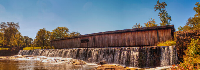 Covered bridge waterfall at Watson Mill State Park in Comer Georgia Pano