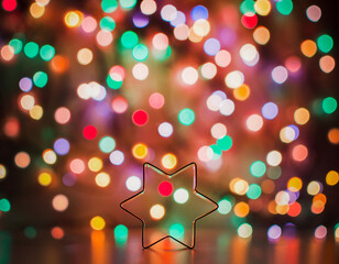 Star for home decoration on the background of Christmas lights. defocus christmas lights.