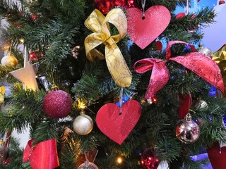 Closeup view footage of Christmas tree decorated with holiday balls and toys.