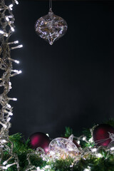 Christmas decoration background with spheres, lights and Christmas plant.