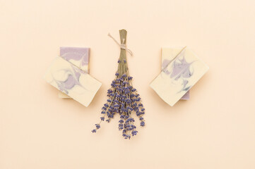 Natural handmade soap with dried lavender and essential oil on pink background. Zero waste concept