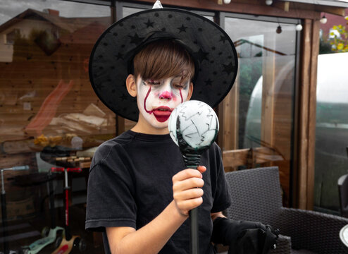 make up clown boy with hat and carnival costume