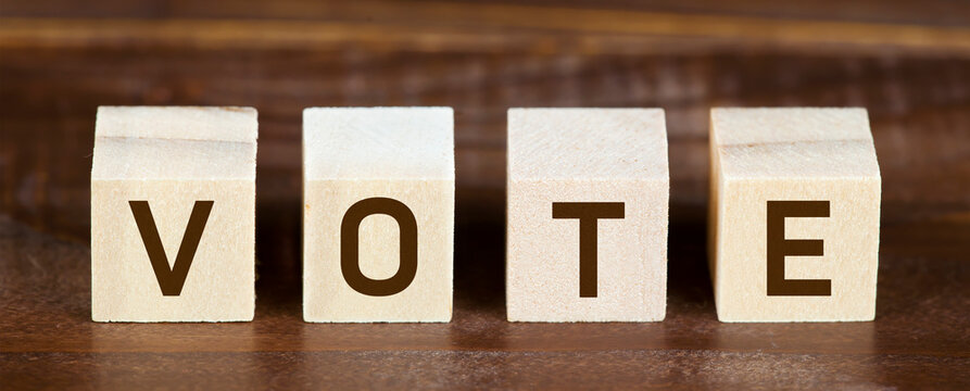 Wooden cubes with vote text. Presidental US 2020 election, voting concept. Web banner.