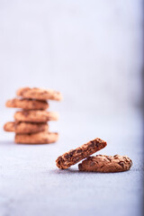 Group of chocolate chip cookies on a neutral background.