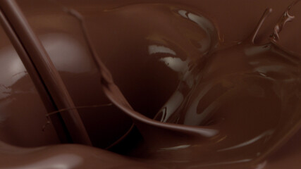 Detail of pouring hot chcocolate with splash