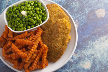 Meal of Breaded Fish Sweet Potato Fries and Peas