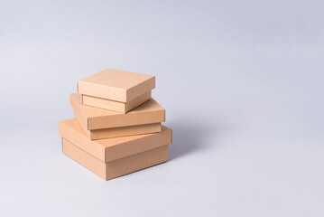 Set of white and brown carton cardboard boxes, copy space on grey background