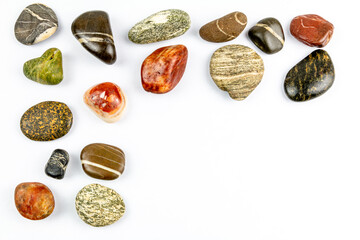 colored stones on white background with space