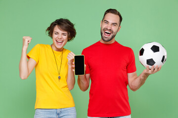 Happy couple friends sport family woman man football fans in t-shirt cheer up support team with...