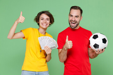 Cheerful couple friends sport family woman man football fan in t-shirt cheer up support team with...