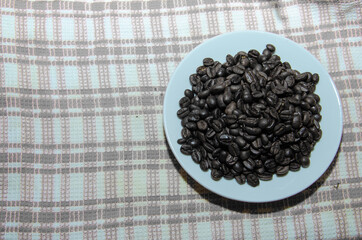 White plate with coffee beans tablecloth the