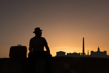 man next to Buenos Aires city skyline silhouette