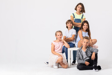 Group of cool children fooling around and making funny poses