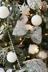 Christmas festive decorations with artificial snow on the Christmas tree. New year holidays