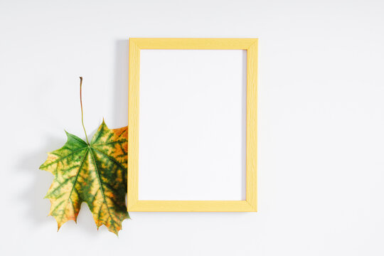 Autumn creative composition. Photo Frame, colorful dry leaves on white background. Fall concept. Autumn background. Flat lay, top view, copy space