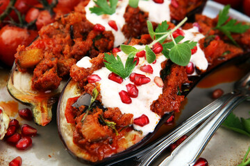 Baked eggplant with tomatoes, garlic and paprika and pomegranate.