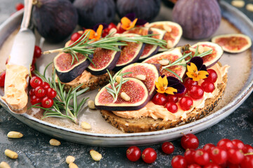 Healthy sweet figs fruit toast with cheese, honey and flower. Fresh fig fruit bread