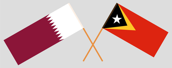 Crossed flags of East Timor and Qatar