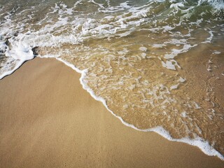 Small sea waves crashing ashore