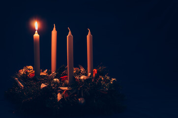 1. advent candle burning on advent wreath