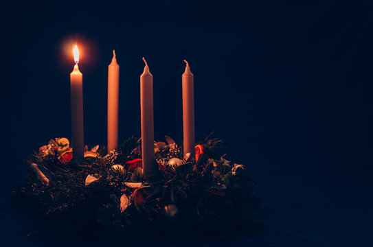 1. advent candle burning on advent wreath