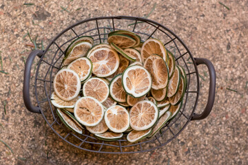 dried citrus fruits arranged in the basket