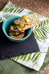 Aguachile, mexican food made with spicy shrimp in a toast.