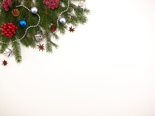 Naklejka na ściany i meble Christmas background - spruce branches are on a white background decorated with Christmas toys.Space for text.Concept 2021
