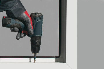 A working installer assembles the window frame