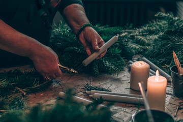 preparation and creation of christmas advent wreath from natural components