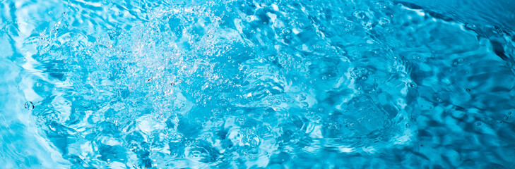 splash of water on a blue background. Abstract wallpaper