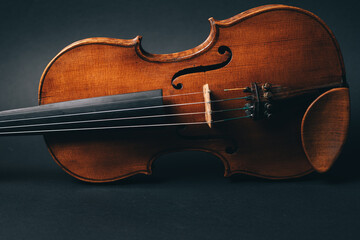 beautiful violin musical instrument on black background. High quality photo