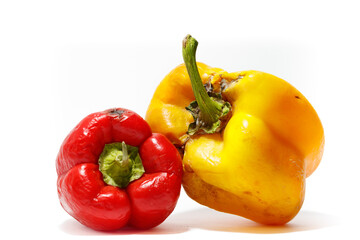 Red and yellow peppers isolated on white background.Sliced red pepper