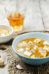 Saag Paneerin a bowl on a wood background