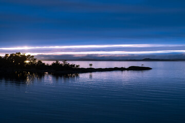 Seascape with small island in Stockholm archipelago at night
