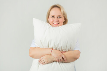 beautiful young plump female in a white t-shirt on a white background