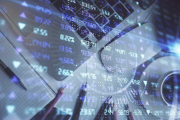 Double exposure of financial chart drawing over table background with computer. Concept of research and analysis. Top view.
