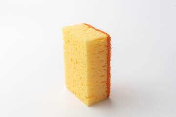 yellow dishwashing sponge on white background