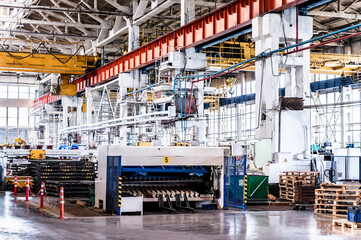 Disassembled tractor parts on the modern tractor factory