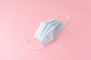 mask on a pink background