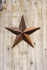 Rusted Metal Star On Wooden Door