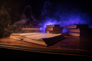 Imagine a picture book of an ancient book opened on a wooden table with a sparkling golden background. With magical power. magic. lightning around a glowing glowing book In the room of darkness